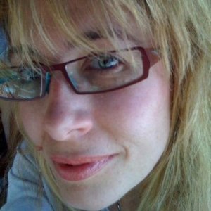 headshot of Shasti McLaughlin a woman in her 40s with blonde hair and glasses